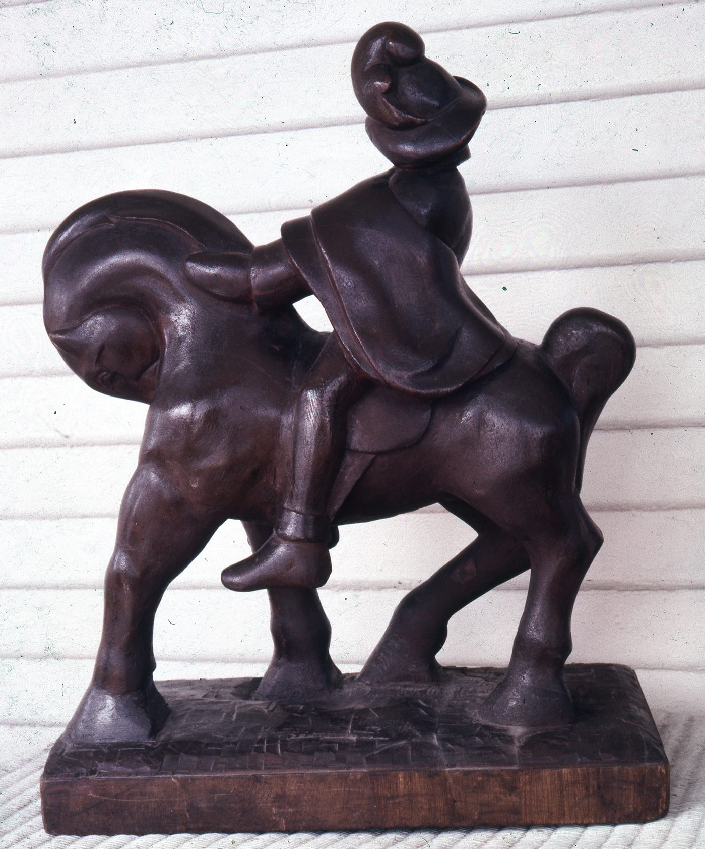 Horse and Rider A small wooden carving of a horse and rider